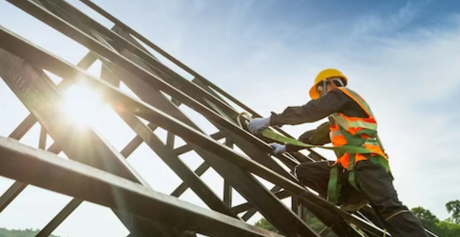 Man assembling the structure of a roof
