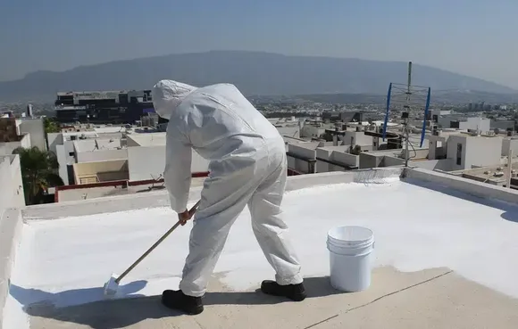 Man painting ceiling